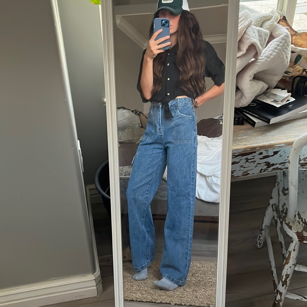 Outfit: includes Jeans and Black Shirt.